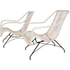 Pair of iron and cord curved seat lounge chairs by Martin Eisler