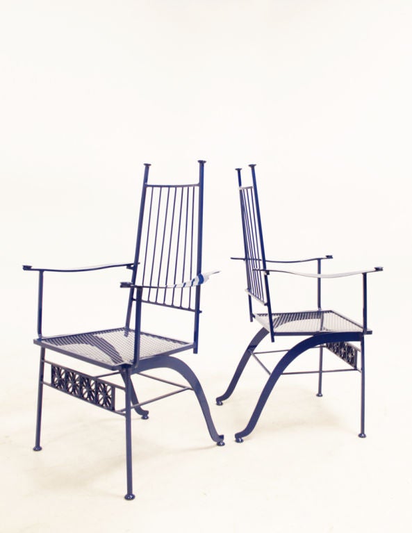 A pair of rare wrought iron patio chairs by Salterini, the premier maker of wrought iron furniture in this era. Newly restored in a charming blue finish.