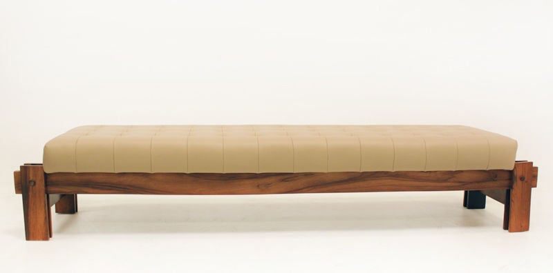 Cantilievered rosewood and leather tufted bench from Brazil