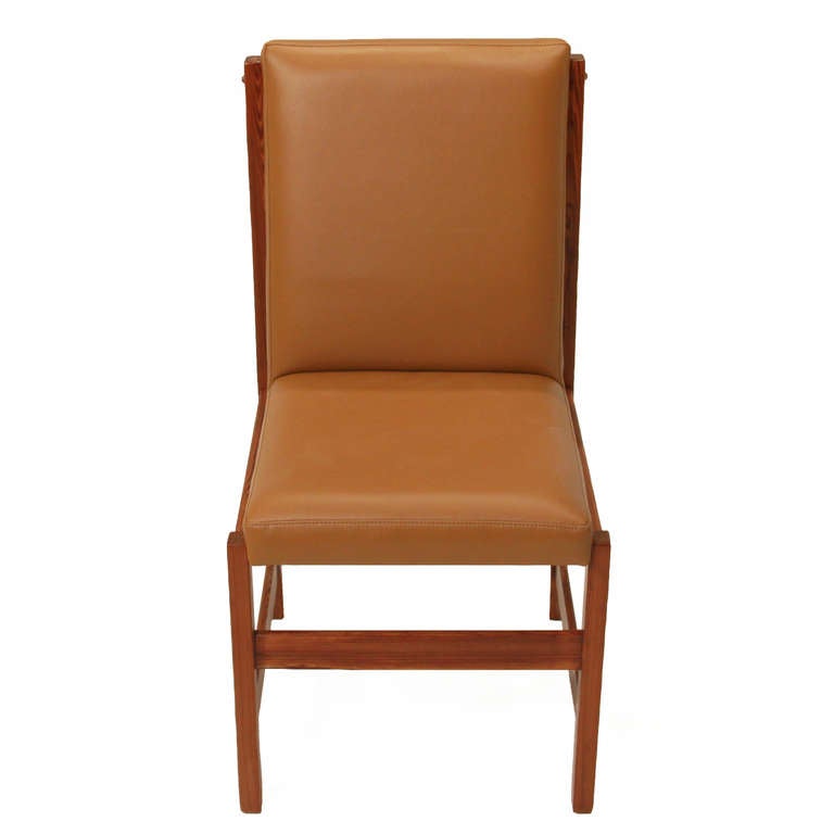 Set of 10 Pinho de Riga and Caramel leather dining chairs by Celina
