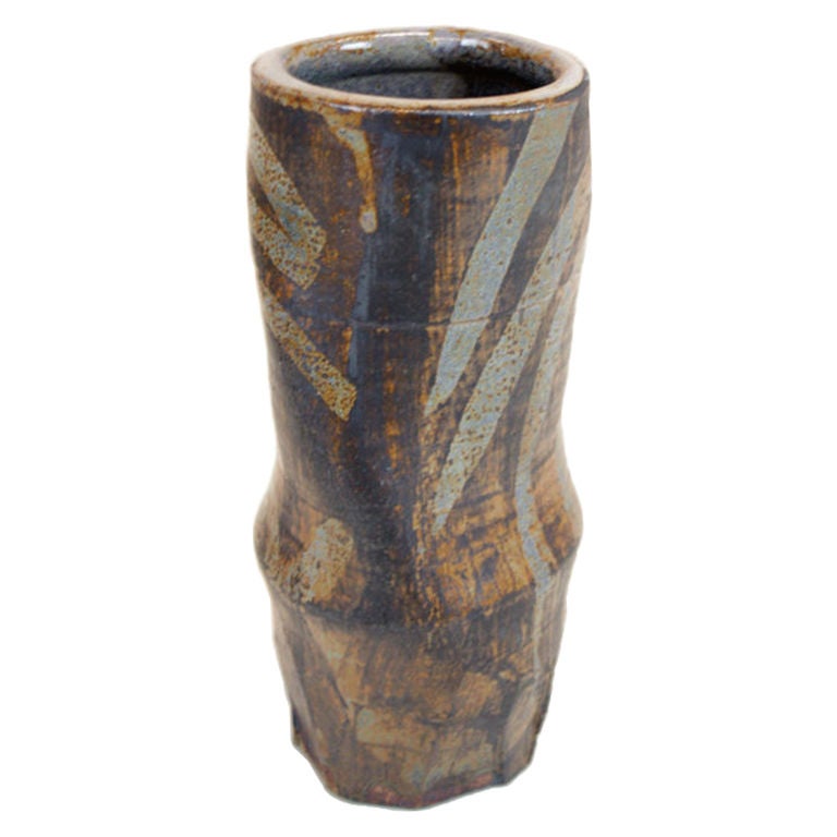 A glazed stoneware vase with blue, black, yellow, and green glaze by Mason.

Many pieces are stored in our warehouse, so please CONTACT US to find out if the pieces you are interested in seeing are on the gallery floor. Thank you!