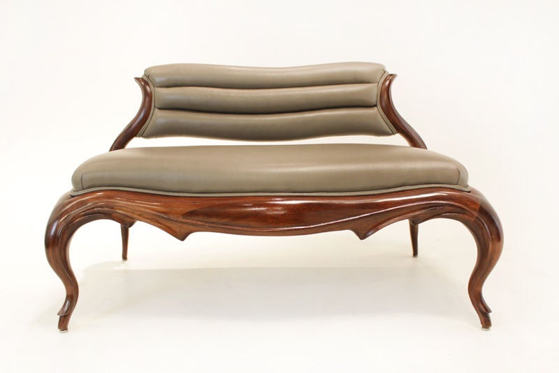 We are pleased to present this exquisite collection of restored sculptural wood furnishings by little-known California designer Ray Leach. The collection was commissioned in 1952 for the home of Joseph Exley in the Garthwick neighborhood of