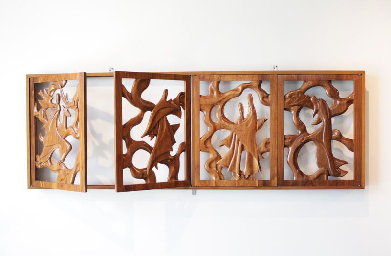 An incredibly crafted window solid walnut window frame designed by Ray Leach. Each shutter contains a beautifully carved human form.
We are pleased to present this exquisite collection of restored sculptural wood furnishings by California designer