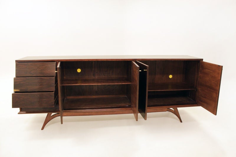 Rosewood cabinet with angled drawers and vintage brass pulls