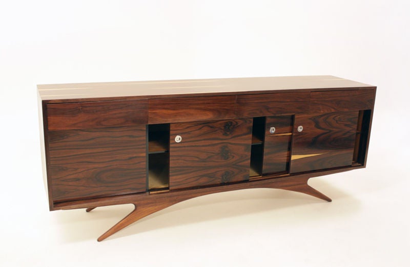 Rosewood cabinet with round chrome pulls and sliding doors
