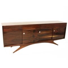 Rosewood cabinet with round chrome pulls and sliding doors