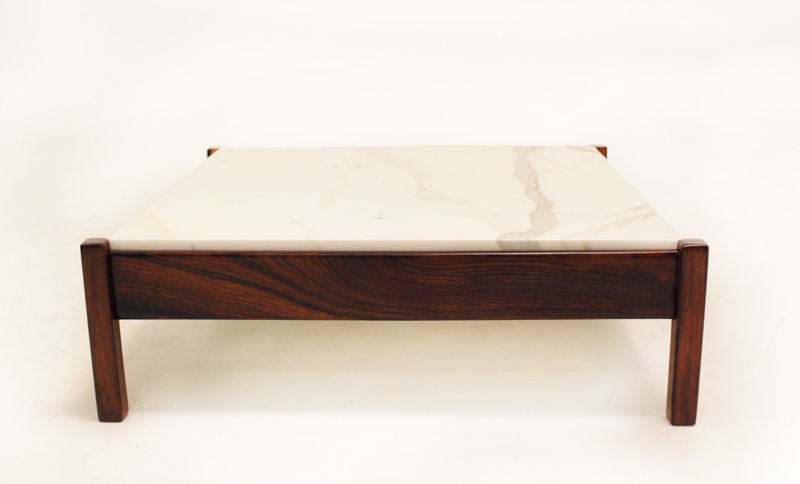 A solid square legged rosewood coffee table with polished white marble top from Brazil. This simple design stands out with its intense Rosewood grain and bright marble.

Many pieces are stored in our warehouse, so please click on CONTACT DEALER
