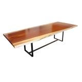A solid Caro Caro slab dining table with bronze flat-bar base A solid Caro Caro slab dining table with bronze flat-bar base
