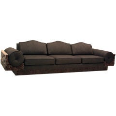 Large carved custom redwood and charcoal fabric sofa