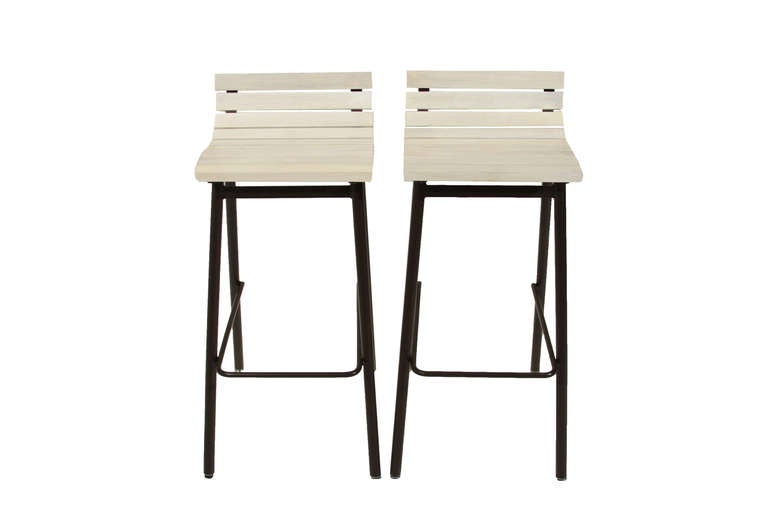 Slat bar stools made with bleached solid Walnut with Satin Lacquer Finish on flat black finished steel frames by Thomas Hayes Studio. Comfortable and sturdy. This listing is for a Set of 2 stools.

Seat measures 14