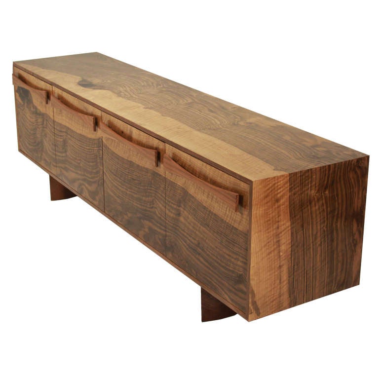 Custom figural Walnut credenza with bow-tie pulls by Thomas Hayes Studio