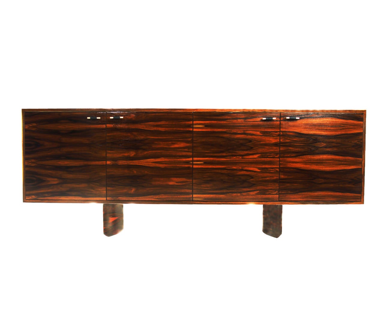 A stunning custom Rosewood credenza by Thomas Hayes Studio with knife edge pedestal legs and pulls made from leather pierced through with polished copper. Pulls are available in brass or copper wrapped in black or natural leather. 

This item is