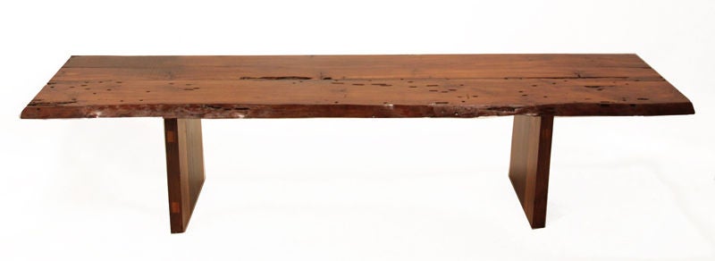 Massive and stunning live edge dining table made from reclaimed Goncalo Alves wood by Brasil's Zanini de Zanine. The double pedestal bases are made from various other exotic Brazilian hardwoods and have beautiful variation in color and grain. The