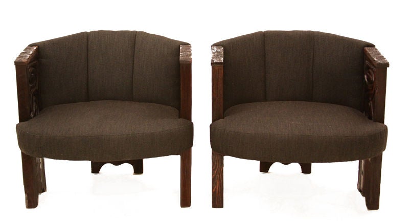 Pair of chairs upholstered in a charcoal fabric with round seat pillows and intricate carving.  A matching sofa is also available:
Seat depth measures 20