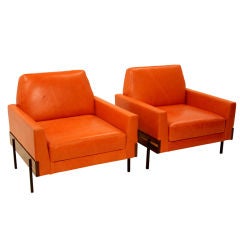 Pair of burnt orange leather arm chairs by Jorge Zalszupin