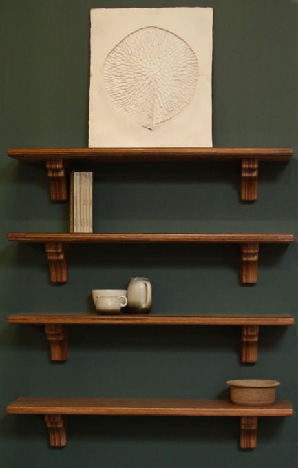 Set of four wall hanging shelves designed by Joaquim Tenreiro. These can be completely flush mounted to the wall as shown in photos, and are quite sturdy.

Many pieces are stored in our warehouse, so please click on CONTACT DEALER under our logo