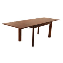 Dining table by Jean Gillon in rosewood with solid legs