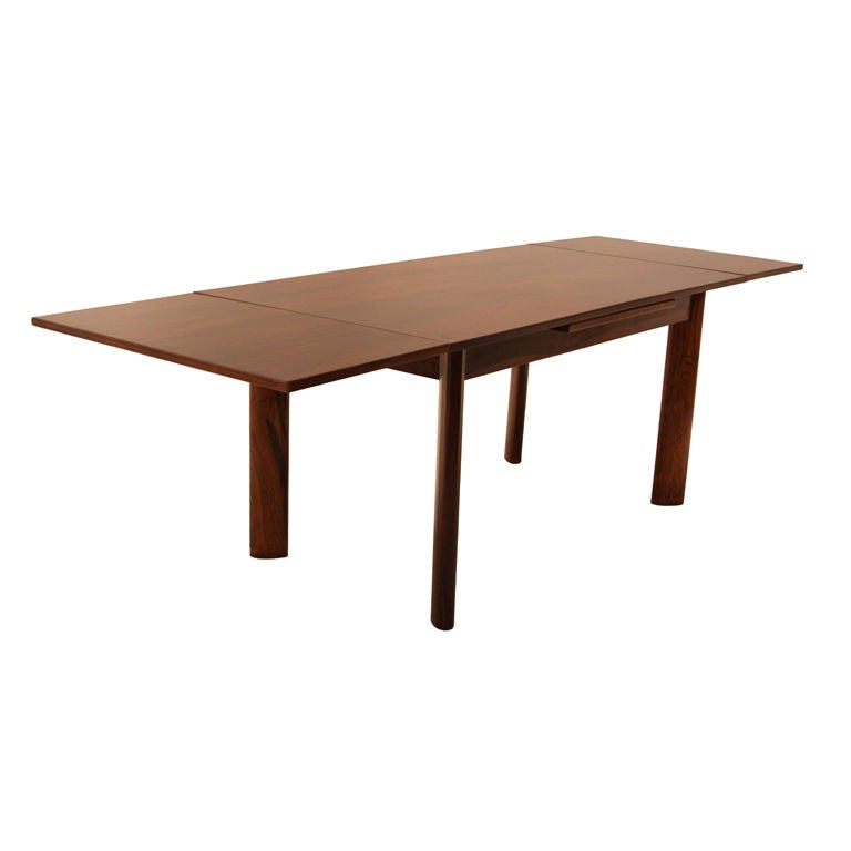 Dining table by Jean Gillon in rosewood with solid legs For Sale