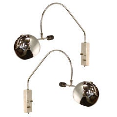 Pair of chrome wall sconces by Robert Sonneman