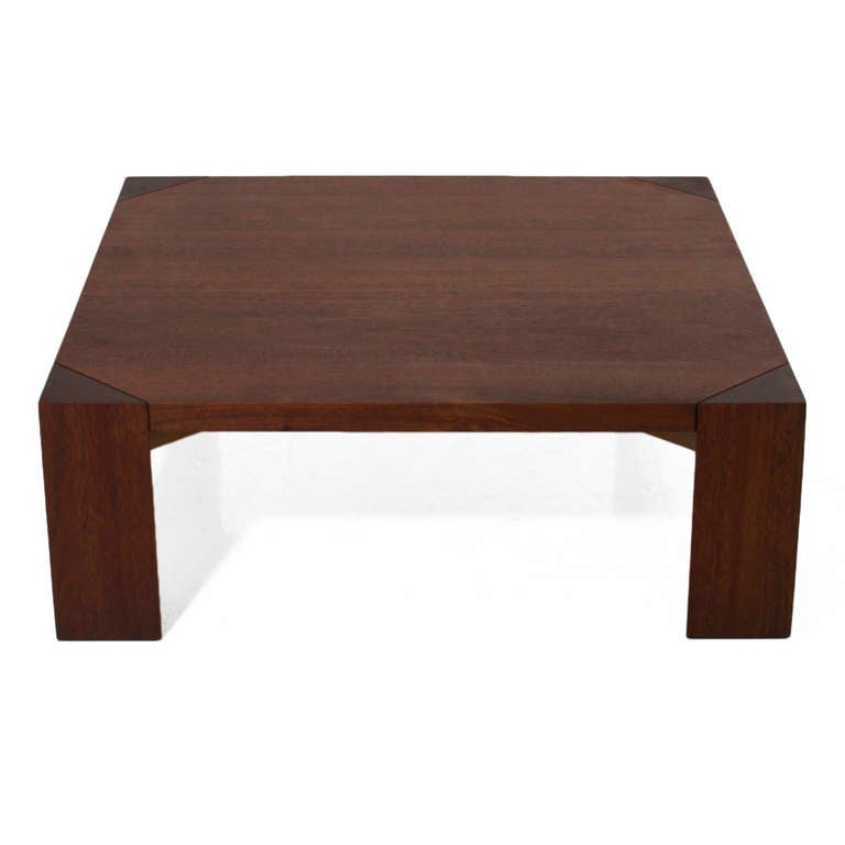 A beautiful solid oak coffee table by California designer Sherrill Broudy with an oil finish. There are four solid wood legs that are triangular shaped. Sherrill Broudy was one of the founders and owners of Panelcarve, which became forms and