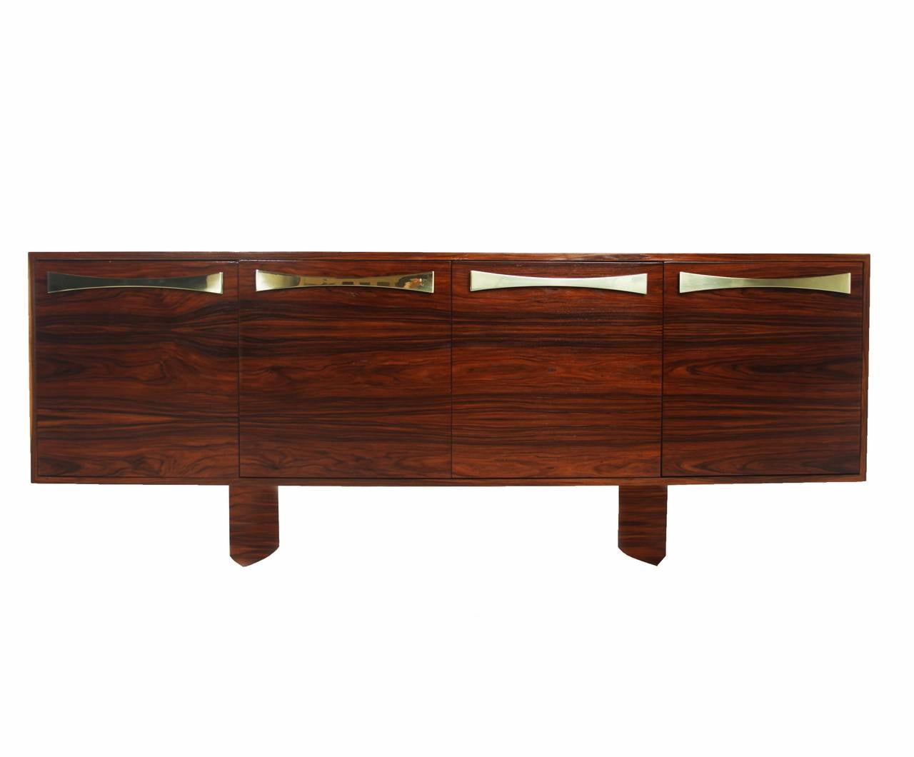 A stunning custom Rosewood credenza by Thomas Hayes Studio with knife edge pedestal legs and solid brass bow tie handles in brass or steel. This item is shown pictured in rosewood but can only be made in oak or walnut

WOOD OPTIONS:
Walnut or