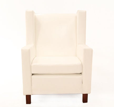 Pair of Brazilian angular white leather armchairs with Rosewood legs.  Thick white leather upholstery.

Many pieces are stored in our warehouse, so please click on CONTACT DEALER under our logo below to find out if the pieces you are interested in