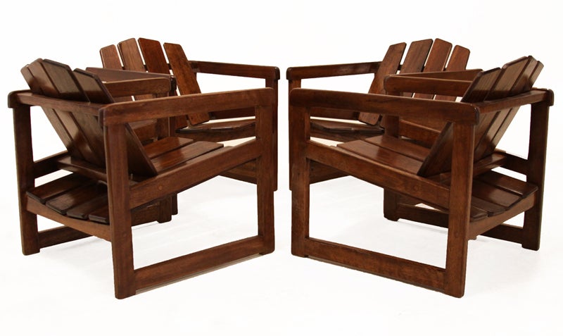Set of 4 Sergio Rodrigues Taja Danif chairs with solid hardwood frames and paneled seats and backs. Very comfortable. Chairs have a lacquered finish and are intended for indoor use.  Price below is for a pair.

Seat depth measures 18.5