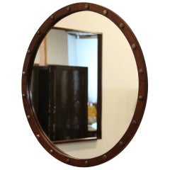 Round Exotic Hardwood mirror with antique bronze details