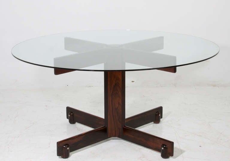 A lovely round dining table with solid Rosewood base and glass top by Sergio Rodrigues. This base can take a larger top or a granite or marble top instead if preferred. 

Base measures 45