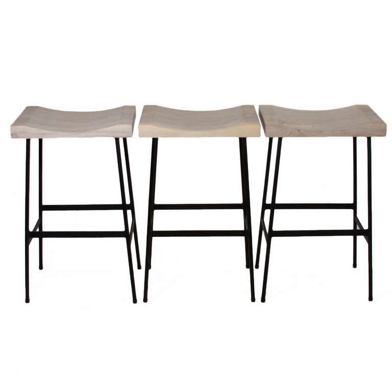 lat black finished steel bar stools with solid carved figural solid wood seats by Thomas Hayes Studio.

This item is available for custom order and the lead time is 6-8 weeks; sometimes we are able to complete projects faster, so please contact us