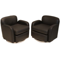 Pair of petite lack leather swivel arm chairs by Milo Baughman