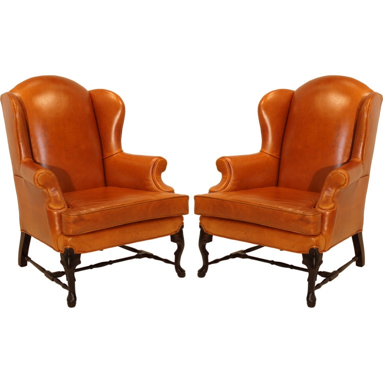 Pair of Leather Wing Back Chairs with Solid Sculptural Feet