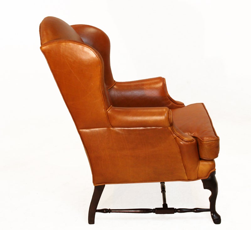 American Pair of Leather Wing Back Chairs with Solid Sculptural Feet