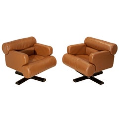 Pair of French burnished leather swivel chairs