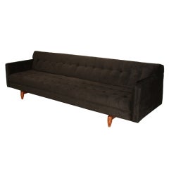 Long sculptural Rosewood and black velvet sofa