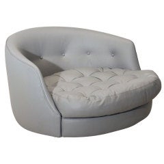 Large round gray leather swivel love chair by Milo Baughman