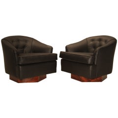 Pair of black leather swivel chairs with Rosewood hexagonal base