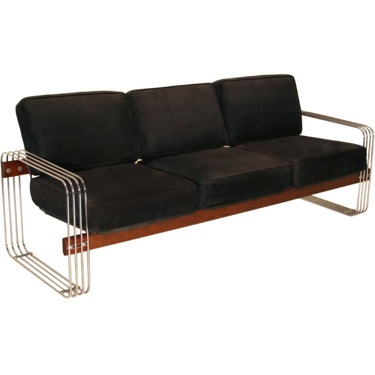 Stendig chrome and redwood sofa with black cushions