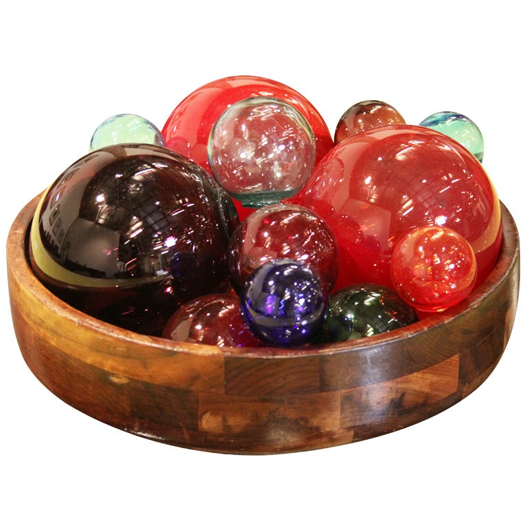 Set of 22 decorative glass balls hand blown in a variety of colors. These decorative pieces could be interpreted as a abstract representations of glass fruit. The pieces float in water.
 
Many pieces are stored in our warehouse, so please CONTACT