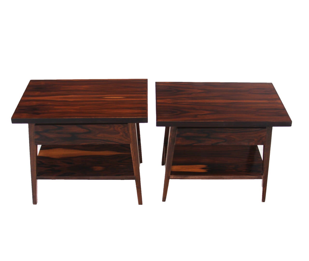Pair of vintage Brazilian Rosewood night stands or side tables with a single drawer apiece and shelves on the bottom for additional storage. 

Many pieces are stored in our warehouse, so please click on CONTACT DEALER under our logo below to find