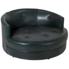 Large round green leather swivel love chair by Milo Baughman