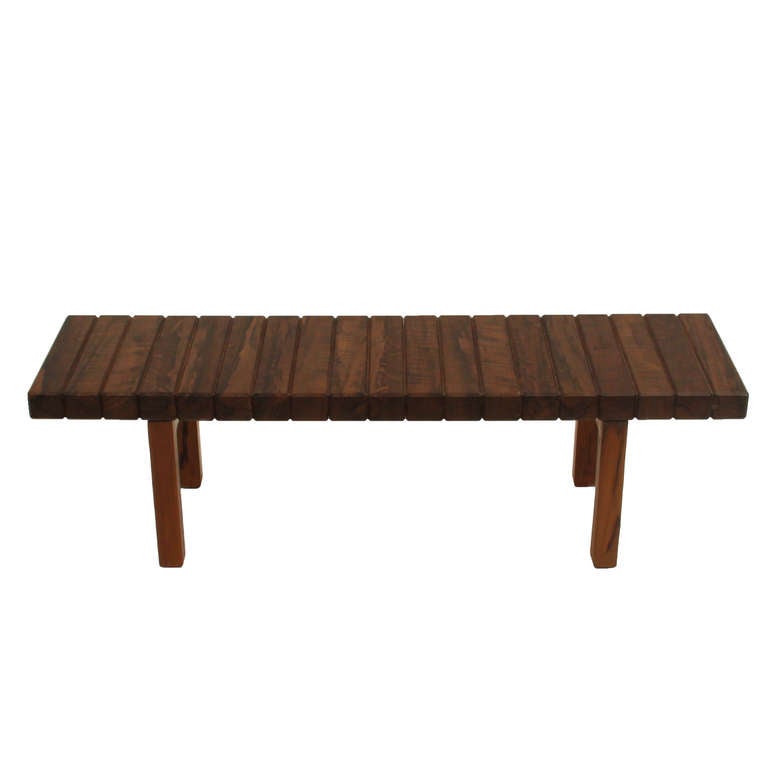 A one-of-a-kind solid beveled Canela wood bench by Rodrigo Calixto. The wood was salvaged from an old factory in Brazil. 

Many pieces are stored in our warehouse, so please click on contact dealer under our logo below to find out if the pieces