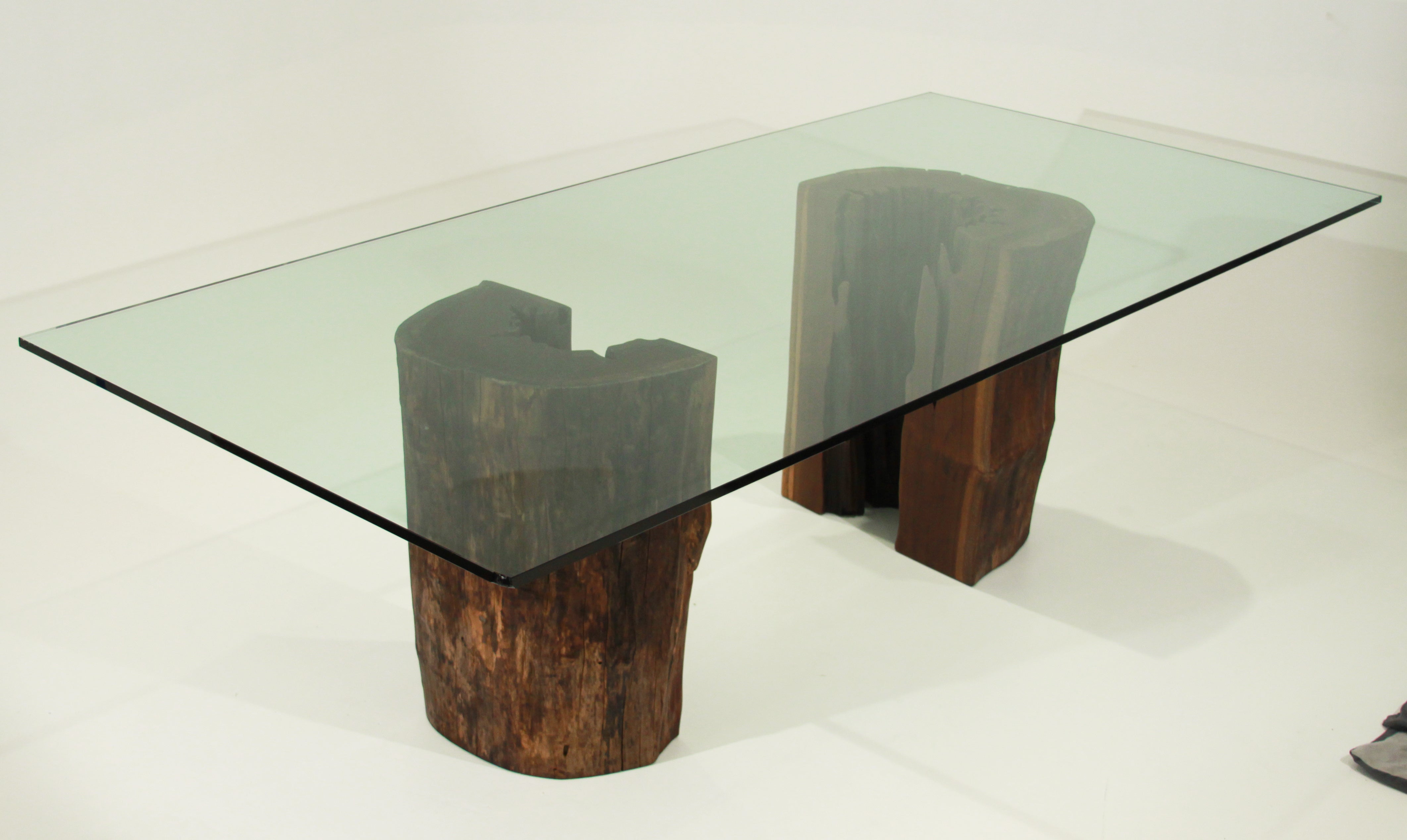 Ipe trunk pedestal dining table with glass top by Tunico T.
