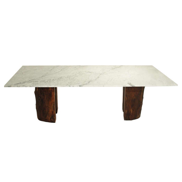 Ipe trunk pedestal dining table with marble top by Tunico T. In Excellent Condition In Hollywood, CA