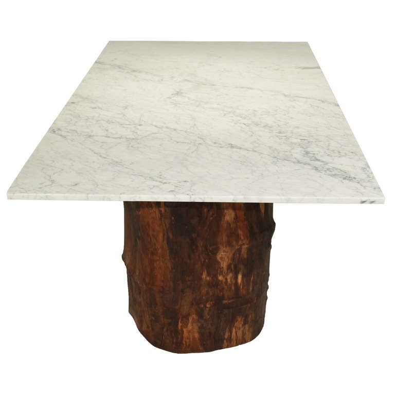 Contemporary Ipe trunk pedestal dining table with marble top by Tunico T.
