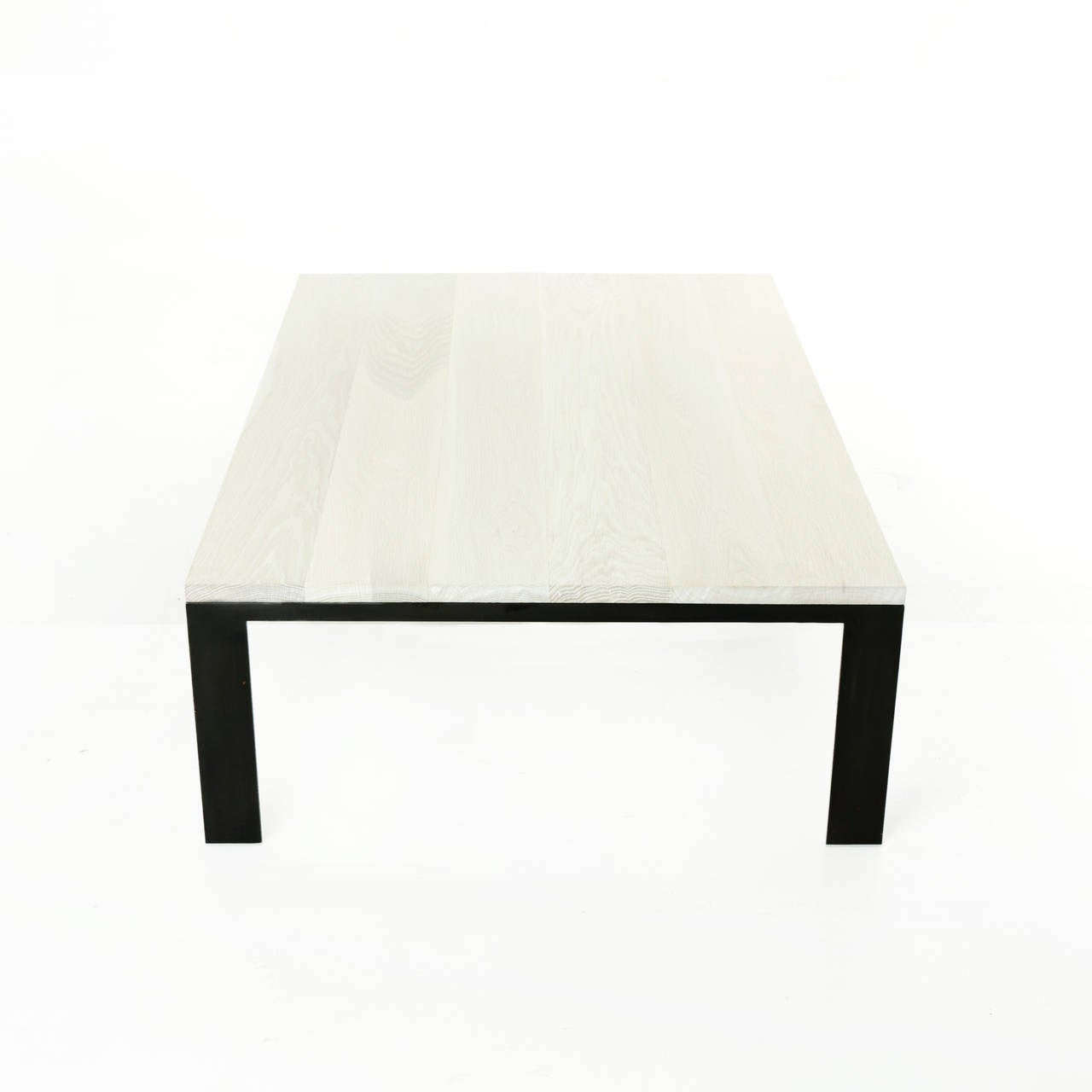 A simply elegant coffee table with a solid oak top with bleached and blanched oil and black powder coated steel legs.

Many pieces are stored in our warehouse, so please click on contact dealer under our logo below to find out if the pieces you