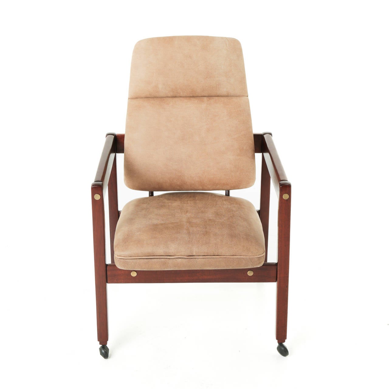 A fine fully restored and refinished tall "Kiko" armchair by Sergio Rodrigues. The chair has a solid rosewood frame, casters and brass plug details. 

Measures: Seat depth: 21 inches.
Seat width: 19 inches.

Many pieces are stored in