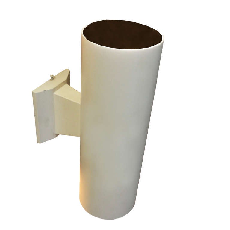 A set of five vintage off-white finished metal cylindrical wall sconces, priced individually. The inside has a black finish, each sconce has up and down lights, and it can use 75 watt bulbs or smaller. These can function as indoor or outdoor lights.