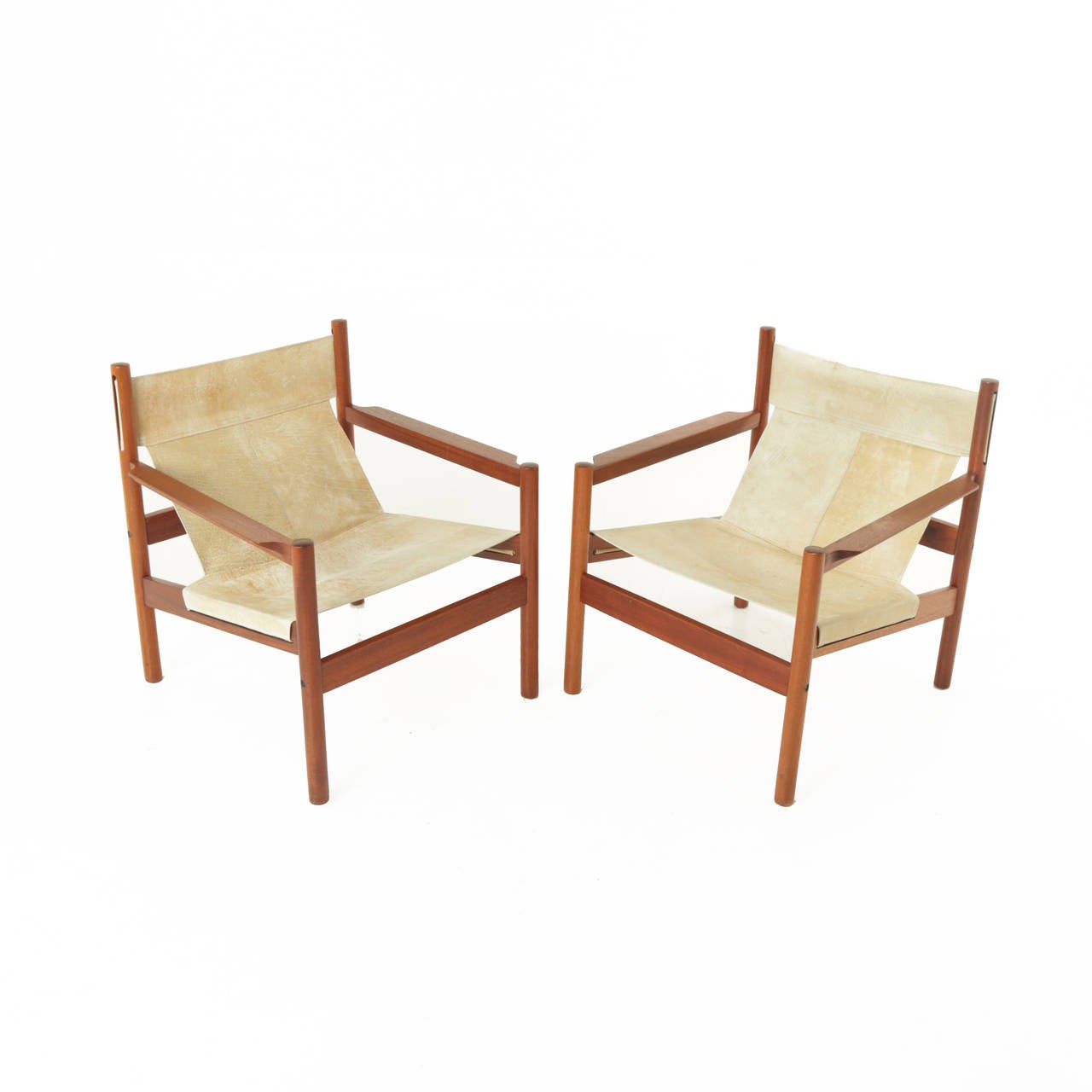 Pair of Roxinho wood and leather sling chairs by Michel Arnoult. The leather is in beautiful aged condition with white stitching.

Seat Depth: 17 in
Seat Width: 23 in

Many pieces are stored in our warehouse, so please click on 