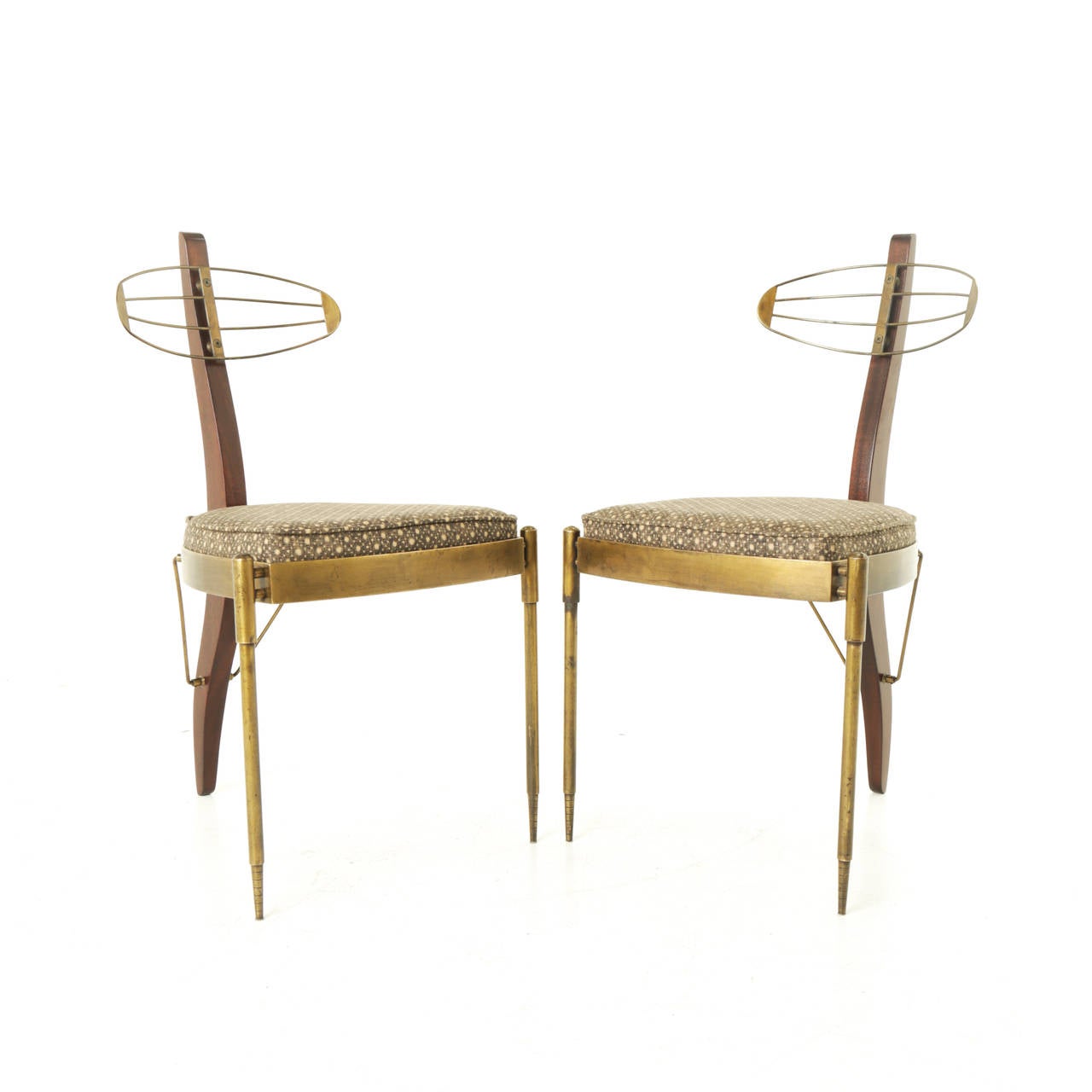 Pair of Pedro Useche’s famous three-legged chair. The solid bronze bases show a rich yet worn patina. They are finely fabricated and constructed with extensive machining. These chairs are truly special and beautiful. Signed by the artist with a